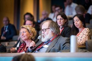 A member of the audience asks a question to Rachel Turner